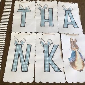 Thank you sign made with bunny ears on card paper